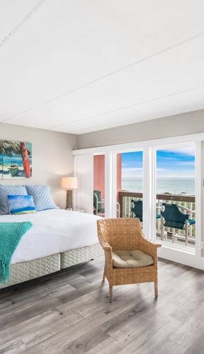 Aerial view of Casa Condominiums with pool and Gulf of Mexico directly behind the building