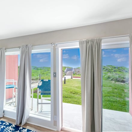 Casa Unit 102 — living and dining area with dune views